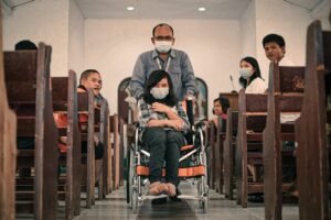 Inalum Berikan Alat Bantu Dengar dan Kursi Roda ke Anak Difabel