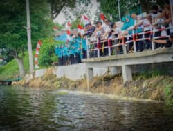 TP PKK Batubara Tanam Pohon dan Tebar Benih Ikan di Danau Laut Tador