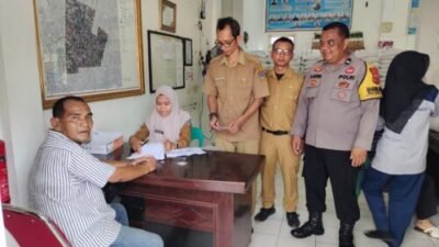 Polsek Padang Hilir Monitoring Pembagian Bantuan Pangan di Kelurahan Rambung